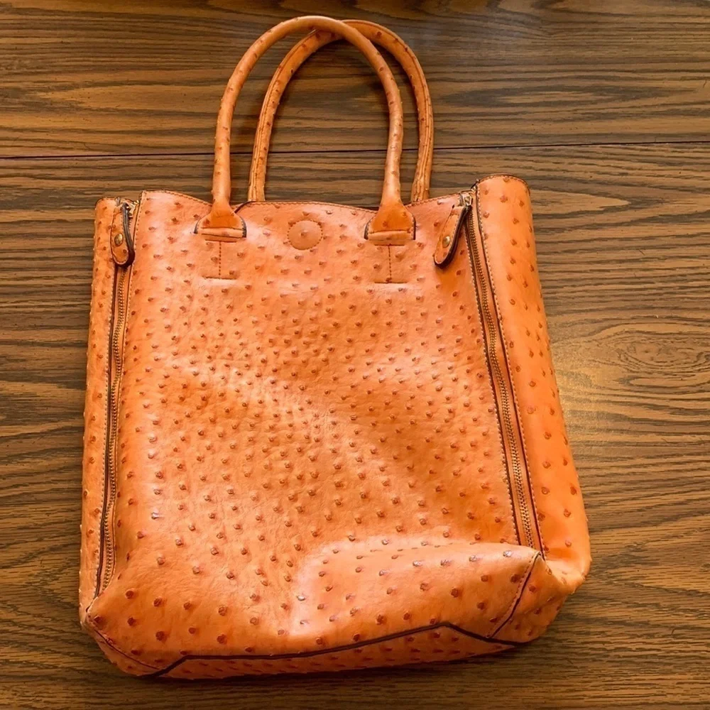 Studio 36 medium to large purse/tote bag. Really nice quality. Orange/4 zip outs